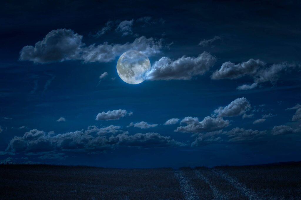 Moon and clouds in the night. Moonlight and road background.